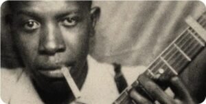 One of the only known photos of blues guitarist Robert Johnson